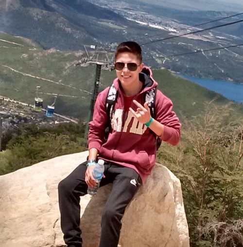 A Picture of Ignacio C. Smiling in a Mountain